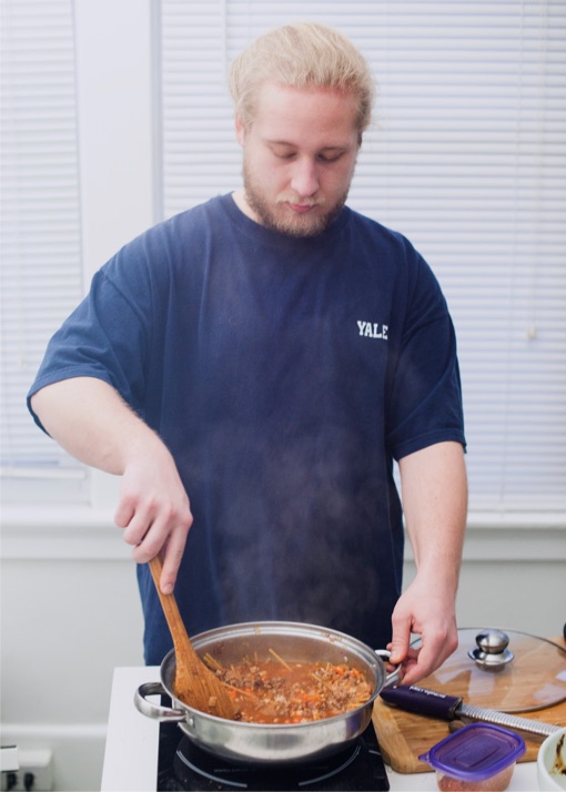 Photo of man stirring pot