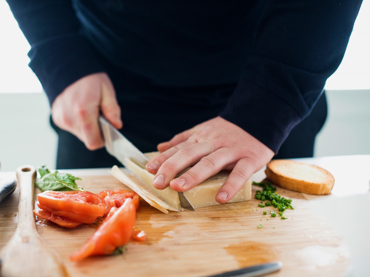 Man slicing cheese